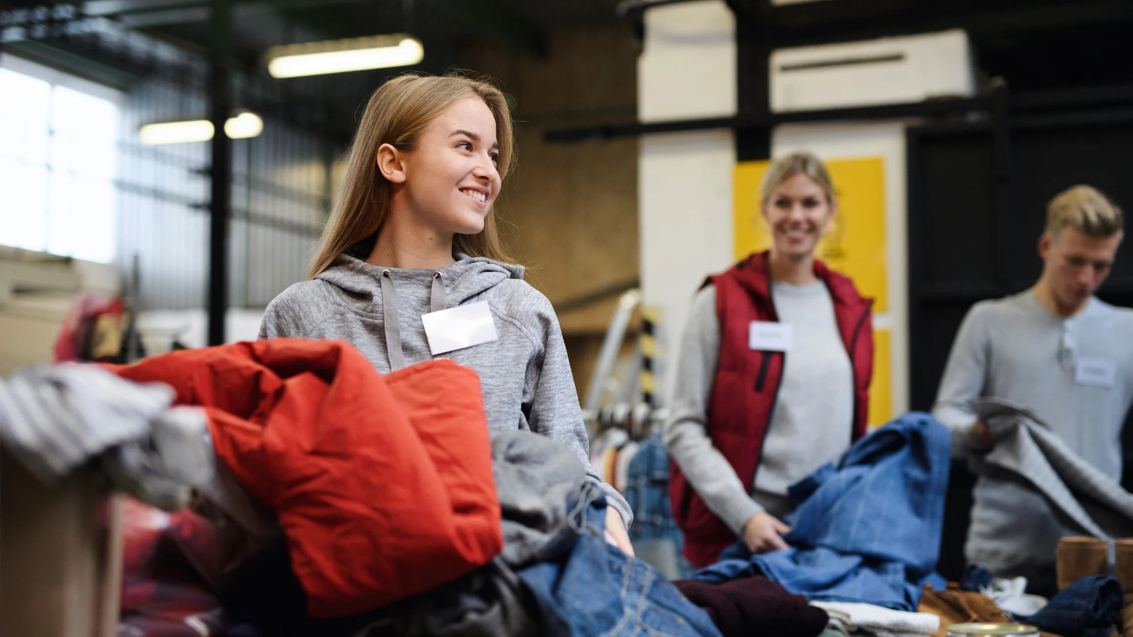 Volunteers sorting clothing donations at a Family Promise of Berks County community service event
